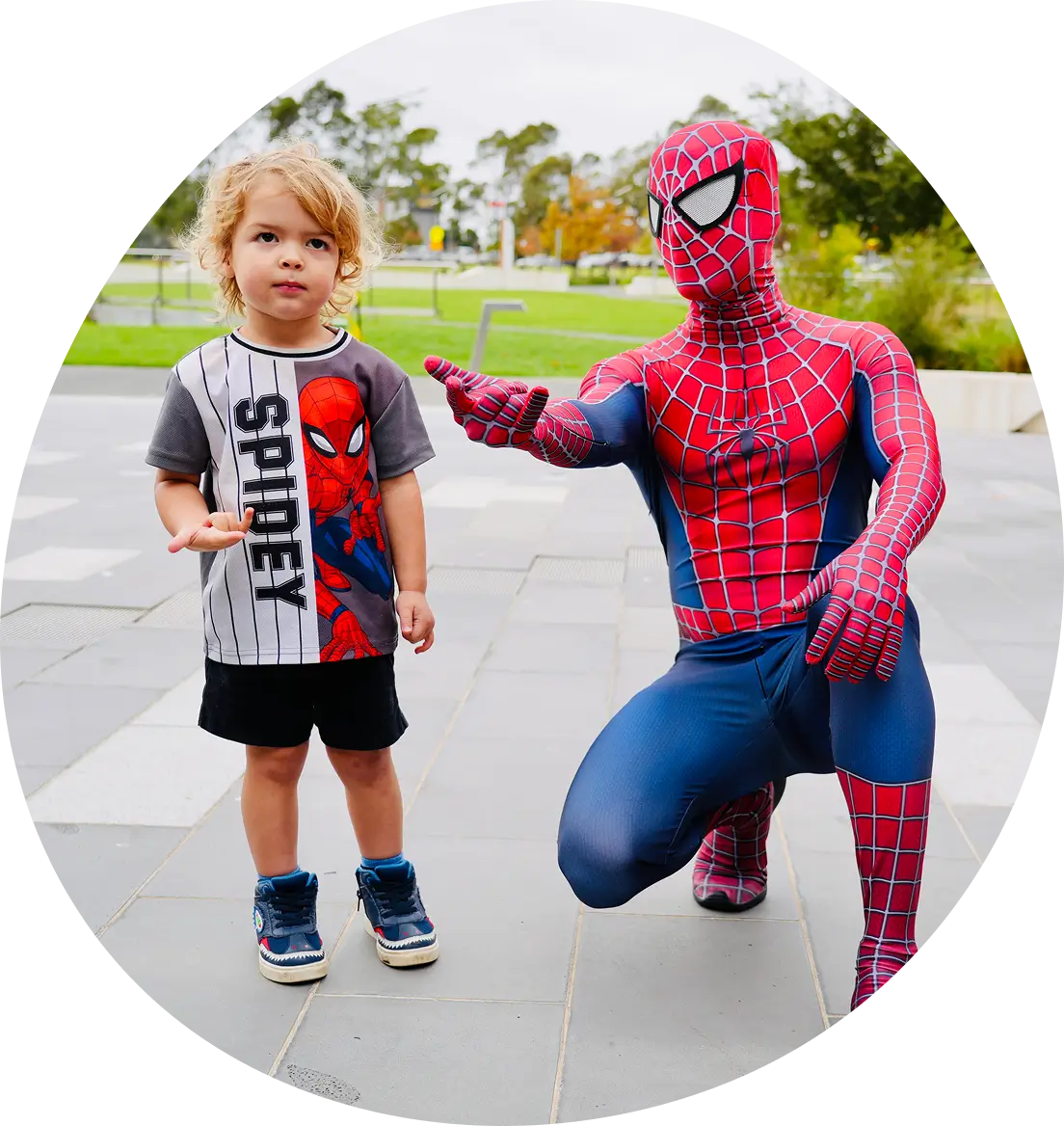 Spider-Party-Character-3 spiderman showing a child to sling a web