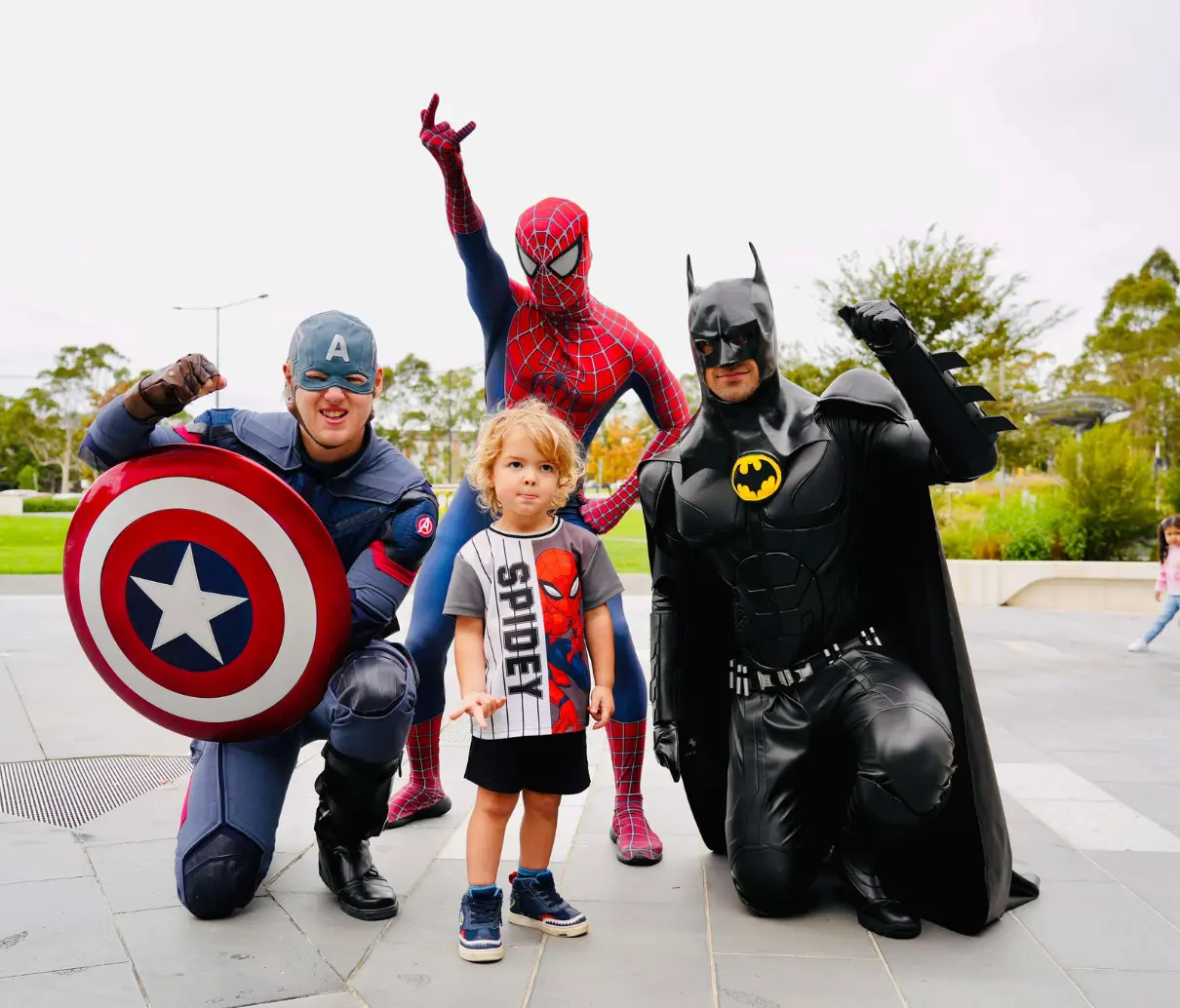 avengery posing with a child