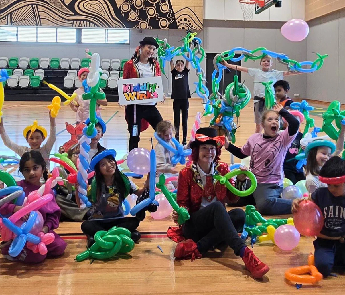 fin with out team at a workshop with balloons
